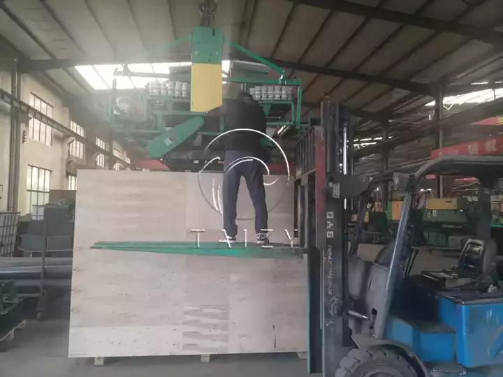 crawler transplanter lifting into export wooden case